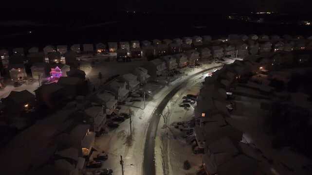 In the aftermath of Halifax's recent snowstorm, a snow plow is diligently clearing the roads at night in Beachville to ensure safe travel for residents