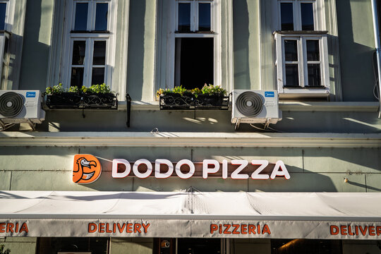 NOVI SAD, SERBIA - JUNE 7, 2026: Dodo Pizza logo and restaurant sign on a building facade in Novi Sad, Serbia, Dodo Pizza is a chain of pizzeria fast foods originating from russia.