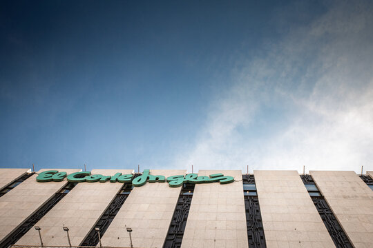 MADRID, SPAIN - FEBRUARY 22, 2026: El Corte Ingles logo on the facade of a department store building in Madrid, Spain, El corte ingles is spanish chain of department stores and retail supermarkets.