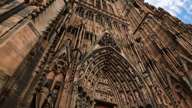 Strasbourg Cathedral facade with intricate Gothic architecture and historical sculptures