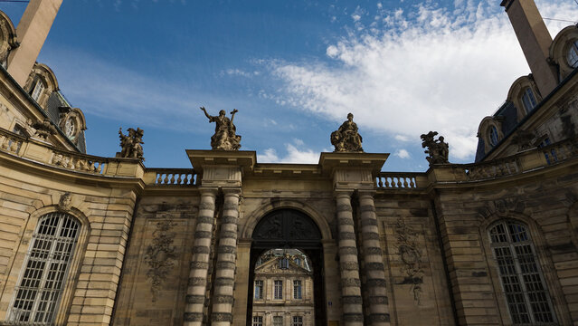 Palais Rohan, a historic Baroque palace, showing its detailed facade and sculptures against a blue sky