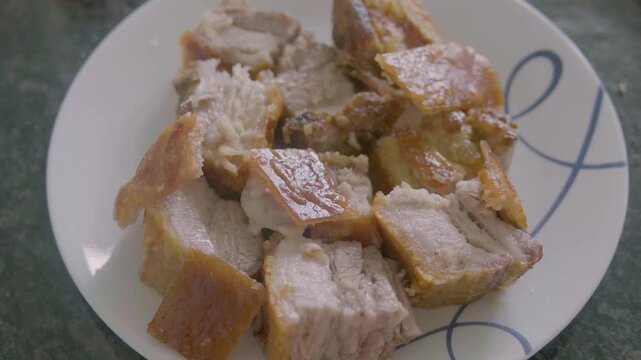 Enjoying lechon in the Philippines during a family gathering in the afternoon