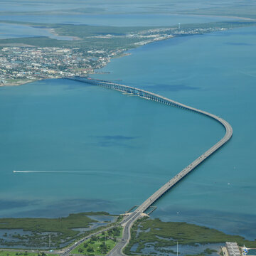 Aerial view of Queen Isabella Bridge going across Laguna Madre, linking South Padre Island and Port Isabel in Texas