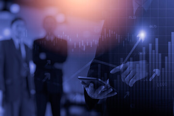 Obraz premium Business man on digital stock market financial indicator background. Digital business and stock market financial indicator on LED. Double exposure of business man and digital stock market financial.