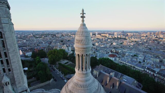 Aerial view of the Sacr&eacute;-C&oelig;ur Basilica dome and Paris skyline at sunset