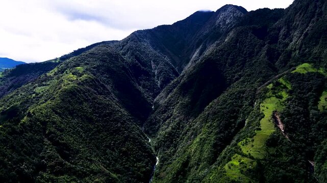 Drone View of Steep Green Ecuador Mountain Ridges, Dense Tropical Forest, Deep Valley and Scenic Andean Amazon Wilderness Landscape Background