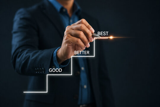 Good to better to best improvement concept. A hand draws steps "Good," "Better," and "Best", symbolizing progress, improvement, and personal or professional growth through incremental advancements.