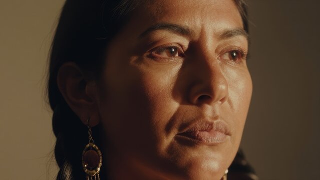 Portrait of a Thoughtful Woman with Elegant Earrings and Deep Eyes