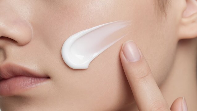 Close-Up of Moisturizing Cream Application on Beautiful Skin
