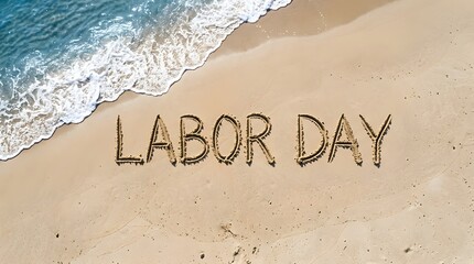Fototapeta premium The words labor day written in the sand on a tropical beach with ocean waves in the background