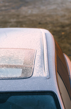 Frozen car roof and windows in wintertime