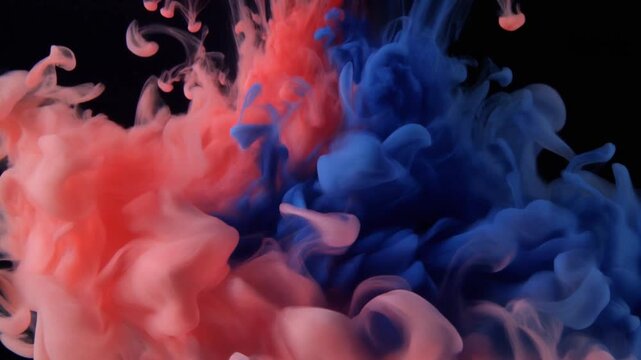 Vivid coral and deep indigo ink blooms through clear liquid, forming organic marbled patterns with striking color contrast under dramatic side lighting in cinematic macro motion.