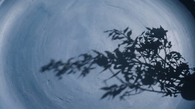 Blue clay surface with soft shadow, subtle texture and minimalist abstract composition for modern background design