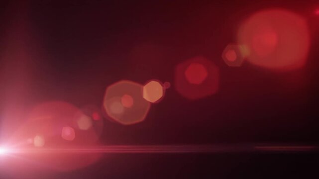 Deep ruby red and crimson light leak blooms across black space with subtle peach gradients, anamorphic lens reflections, optical bloom and soft bokeh for cinematic video overlays.