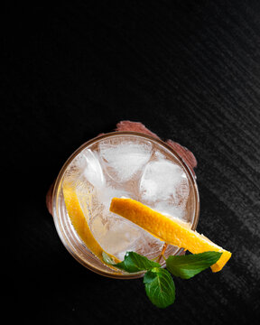 Top View of Refreshing Citrus Cocktail With Orange Slices Mint and Ice