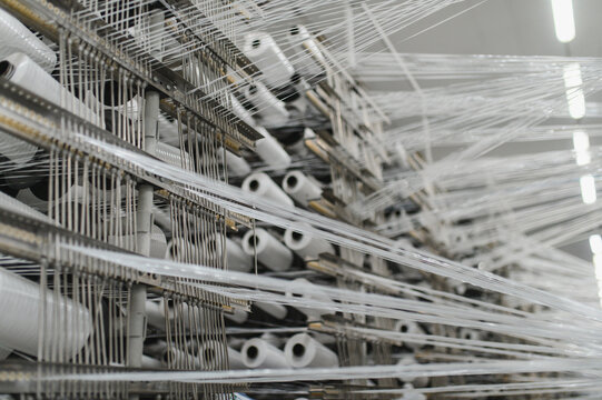 Polypropylene threads winding on textile factory machinery