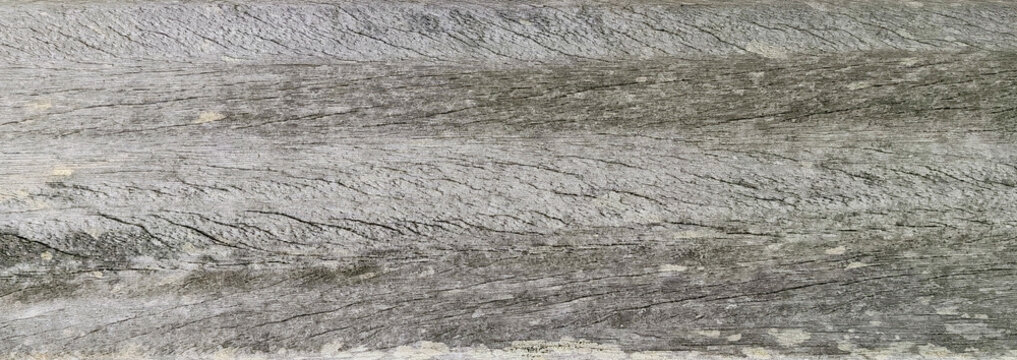 Old weathered grey wood plank background surface texture with rough linear grain