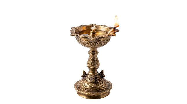Traditional brass oil lamp with burning flame, ornate Indian diya for Diwali celebration, golden metal oil lamp for spiritual prayer rituals isolated PNG with Transparent Background