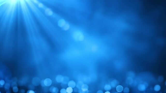 Light leak blue video graphic effect background animation concept. Bright blue light rays with bokeh effect creating a glowing abstract background