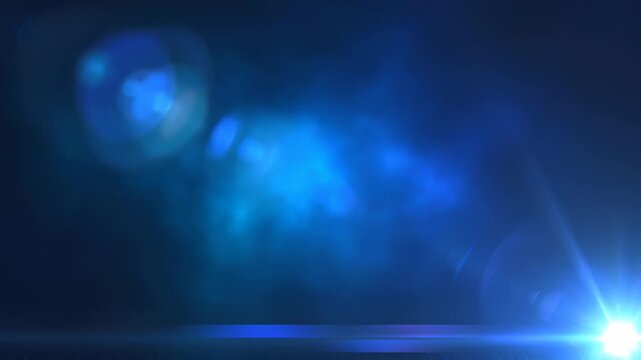 Light leak blue video graphic effect background animation concept. Bright blue light flare glowing with lens reflections in dark background for futuristic design