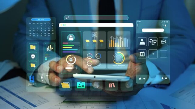Business person using a tablet with floating hologram digital dashboard screens, data charts and app icons, showing modern technology, online management and office work 