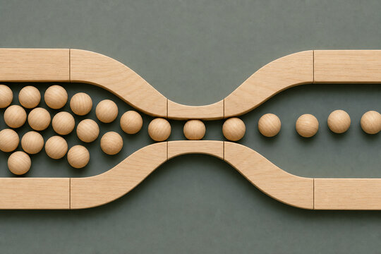 Wooden beads move through narrowing hourglass pathway, illustrating business bottleneck, workflow constraints, process delays, operational inefficiency and restricted productivity in minimalist flat l