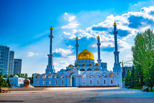 Abu Nasr al-Farabi mosque with golden dome and minaret against blue sky in Astana Kazakhstan