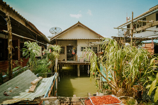 Traditional wooden stilt house village on water in Southeast Asia