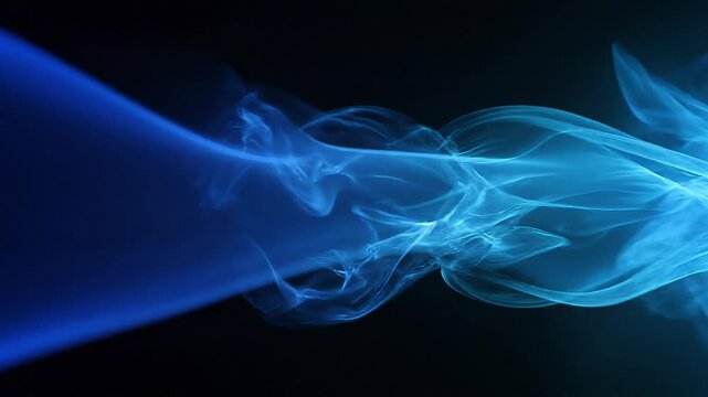 Abstract blue smoke swirling on black background with smooth flowing shapes and soft texture