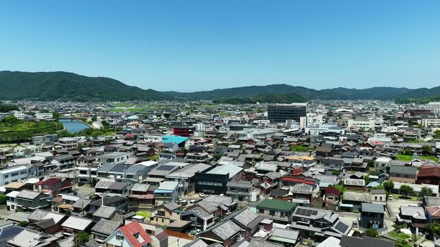 Aerial drone footage over urban area of Gobo City, Wakayama, Japan