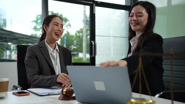 Lawyer shakes hands with a client after discussing and finalizing a contract agreement. Legal consultation, trust, and partnership in business law.