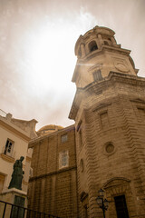 Cádiz Cathedral bell tower and historic architecture with statue in Andalusia, Spain © JoseManuel