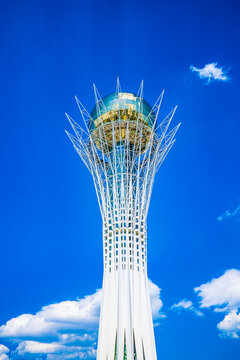 Astana, Kazakhstan, 05.08.2026: Baiterek tower monument low angle view against blue cloudy sky
