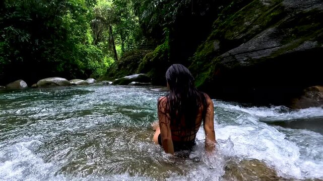 Person Standing in Clear Rainforest River Rapids in Ecuador, Tropical Jungle Canyon, Freshwater Adventure and Ecotourism Travel Scene