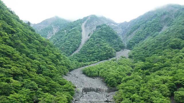 Aerial drone footage of mountain collapse and rocky slopes in Shizuoka City, Japan