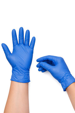 Hands in blue gloves against white background