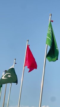 Waving Pakistan Turkey and Saudi Arabia Flags Under Blue Cloudy Sky, International Relations and Economic Cooperation Concept