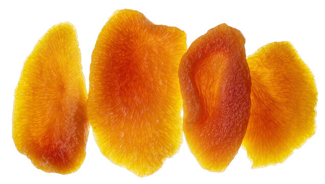 Isolated delicious dried mango slices, translucent vibrant orange sweet tropical fruit pieces