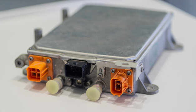 Electric car's high-voltage wiring system connected to the onboard charger (OBC), PDU, and battery.  EV control electronics, green energy systems, and advanced automotive technology infrastructure