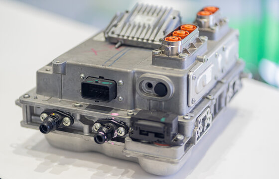 Electric car's high-voltage wiring system connected to the onboard charger (OBC), PDU, and battery.  EV control electronics, green energy systems, and advanced automotive technology infrastructure