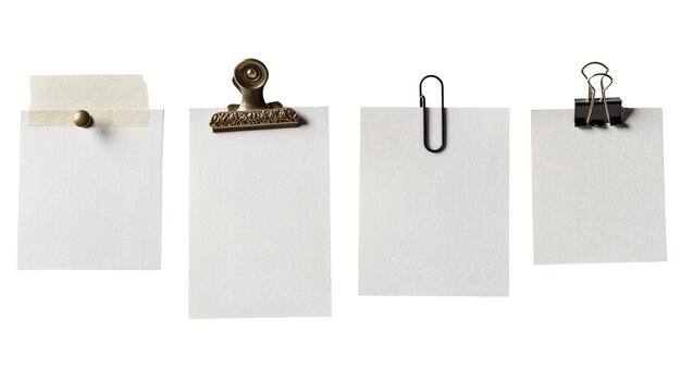 Isolated simple blank paper notes secured by various metal clips and sticky tape