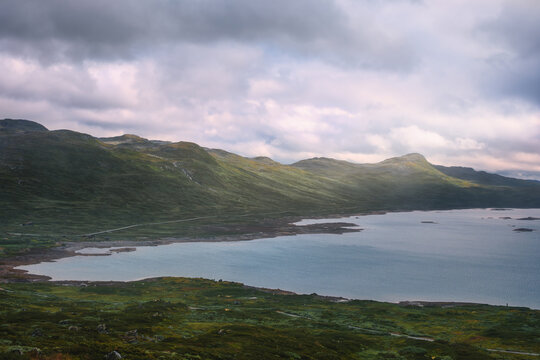 Scenic view of Tyinholmen lake and surrounding mountains, Jotunheimen NP, Norway