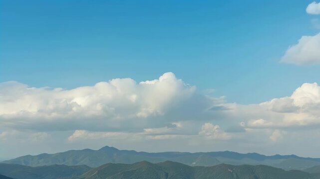 Blue sky clouds over mountain landscape serene horizon and nature scenic view