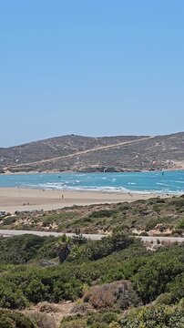 Prasonisi Coast on Southern Rhodes with Blue Sea, Sandy Beach and Windsurfing Kites at Famous Meeting Point of Two Seas, Greece, July 2026