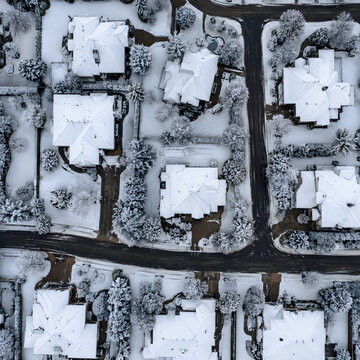 Aerial View of Snow Covered Residential Neighborhood in Winter
