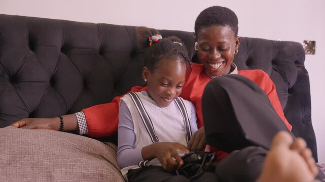 Family game happiness. Parents and children joyfully play together. Shared gaming times foster family connection and fun. Children and parents unite through joyful gaming experiences full of laughter