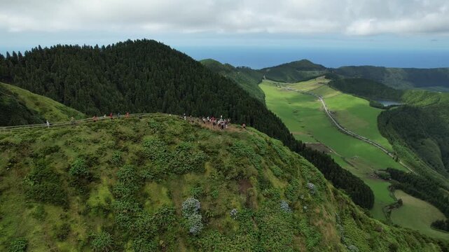 Aerial drone view of Miradouro da Grota do Inferno overlooking the volcanic lakes and lush landscape of Sete Cidades, Sao Miguel, Azores, Portugal