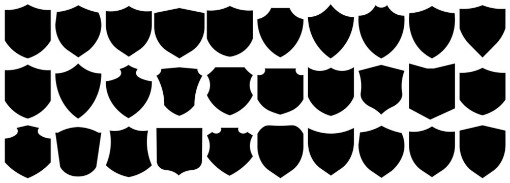 Collection of various black shield silhouettes for security and heraldry