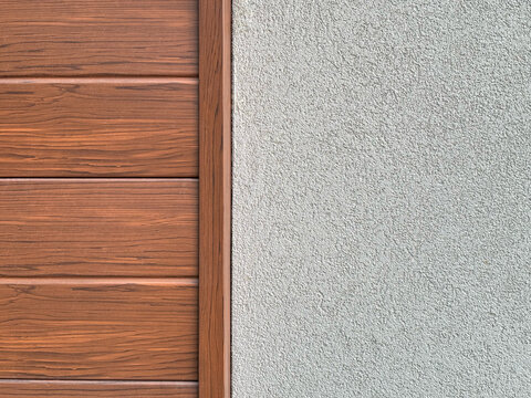 Modern architectural background featuring split textures of warm wood panel siding and neutral gray stucco wall finish