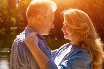 Close Profile Portrait of a Smiling Mature Couple in Love © Екатерина Переславце
